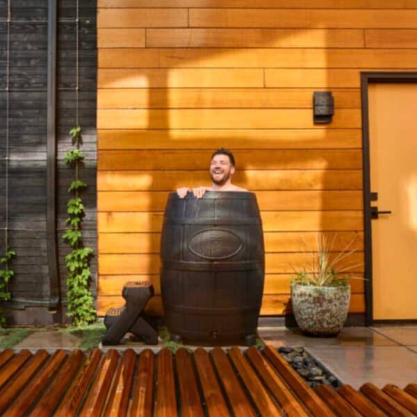 man smiling in ice barrel 400