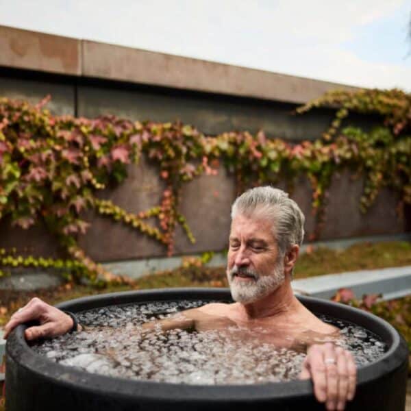 older man in Ice barrel 300 cold plunge