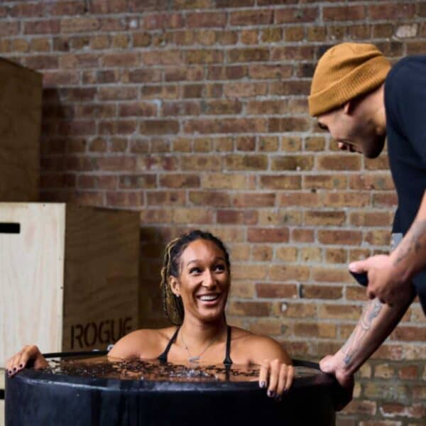 Woman doing cold plunge in Ice Barrel 300